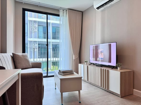 living room and bedroom of Metro Luxe Riverfront Rattanathibet