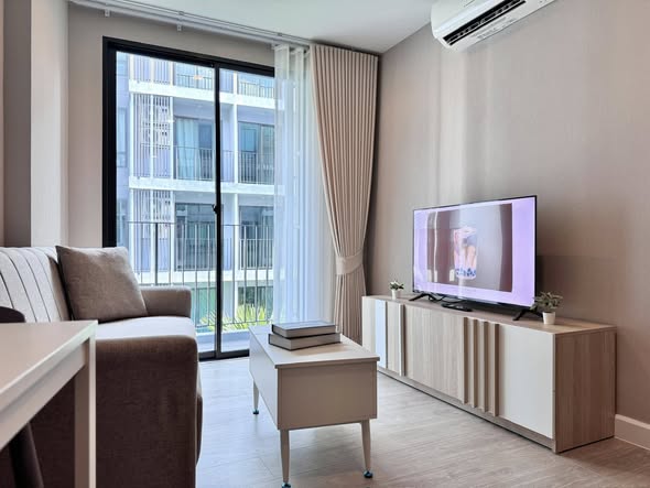 living room and bedroom of Metro Luxe Riverfront Rattanathibet