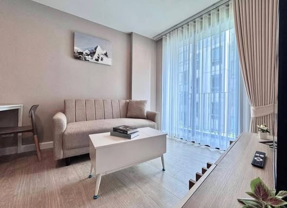 living room and bedroom of Metro Luxe Riverfront Rattanathibet