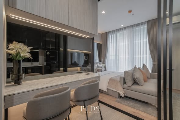 living room and bedroom of Noble Around Ari