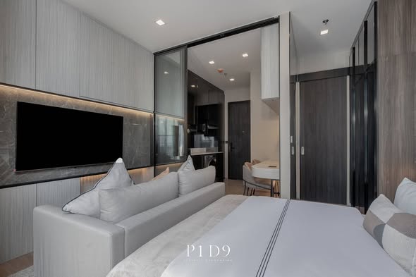 living room and bedroom of Noble Around Ari