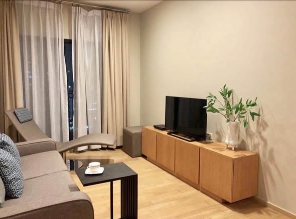 living room and bedroom of Noble Reveal
