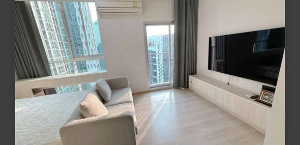 bedroom and living room of Noble Revolve Ratchada 1