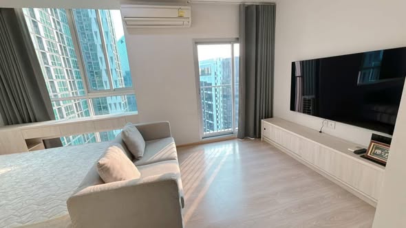 bedroom and living room of Noble Revolve Ratchada 1