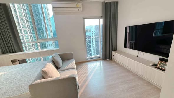 living room and bedroom of Noble Revolve Ratchada 1