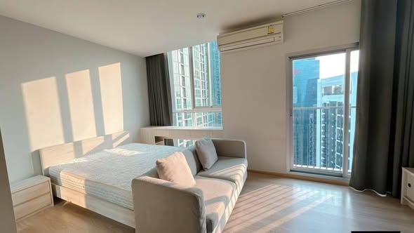 living room and bedroom of Noble Revolve Ratchada 1