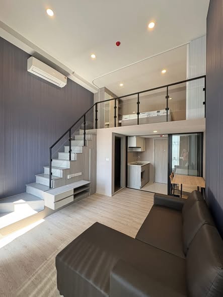 living room of Origin Plug & Play Sirindhorn Station