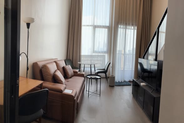 living room and bedroom of Park Origin Chula-Sam Yan
