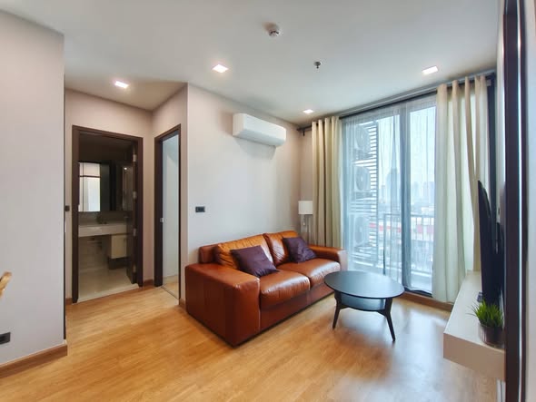 bedroom and living room of Q House Sukhumvit 79