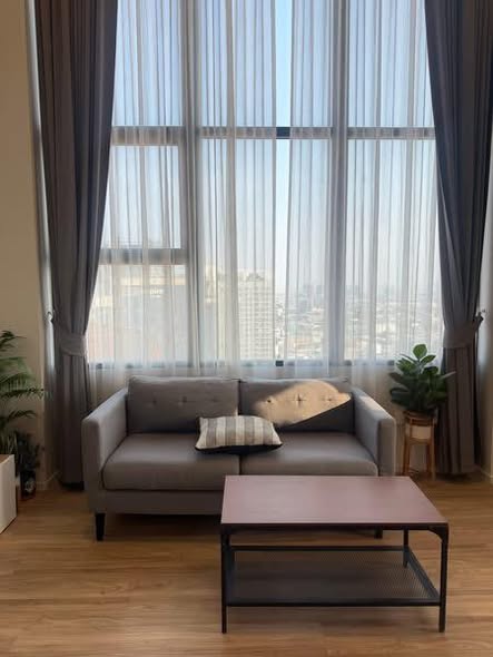 living room and room interior of Ramada Plaza by Wyndham Bangkok Sukhumvit 48