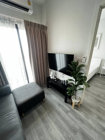 living room and bedroom of Rich Park Triple Station