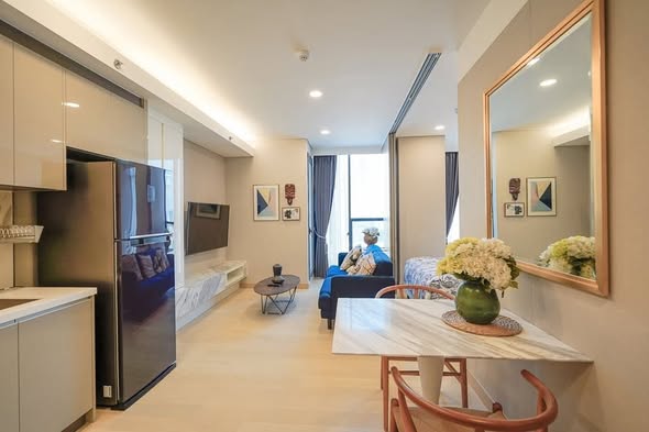 living room and kitchen of Siamese Exclusive Queens ไซมีส เอ็กซ์คลูซีฟ ควีนส์