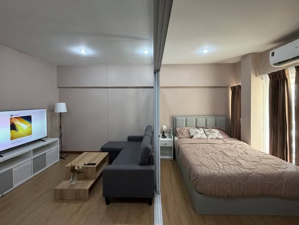 bedroom of Studio One Condo