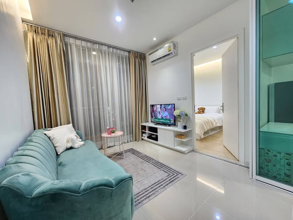 living room and bedroom of TC-Green Condominium