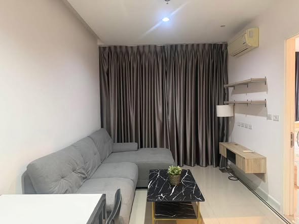 living room and bedroom of TC-Green Condominium