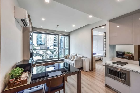 living room and kitchen of The Address Sathorn