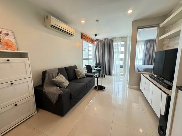 bedroom and living room of The Clover