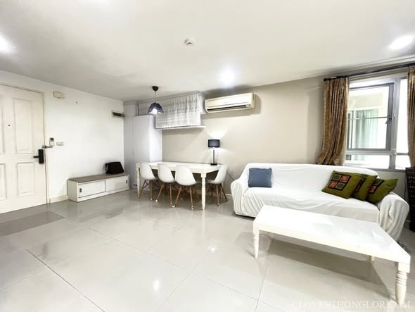 bedroom and living room of The Clover