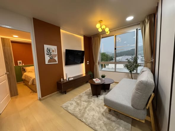 bedroom and living room of The Clover