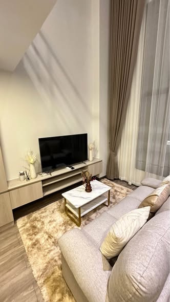 bedroom and living room of The Collect Ratchada 32