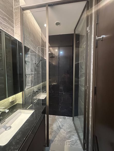 room interior and bathroom of THE ESSE Sukhumvit 36
