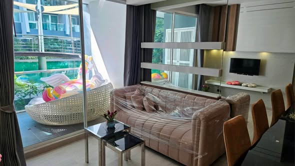 bedroom and living room of The Feelture Condominium