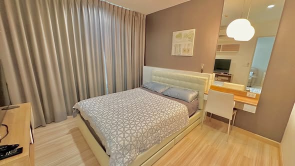 bedroom of The Hotel Serviced Condo เดอะโฮเทล คอนโด