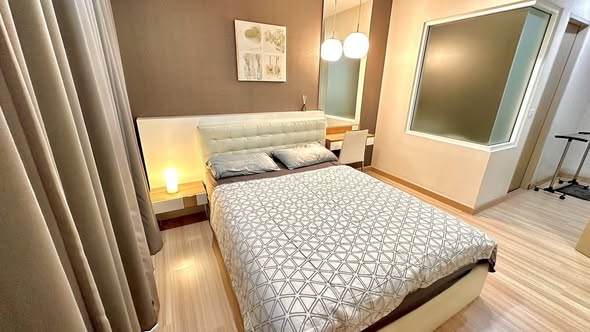 bedroom of The Hotel Serviced Condo เดอะโฮเทล คอนโด