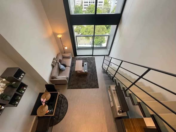 living room of The Lofts Silom by Raimon Land