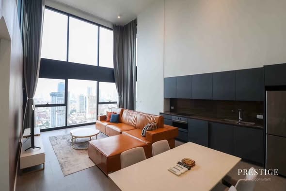 living room and bedroom of The Lofts Silom by Raimon Land