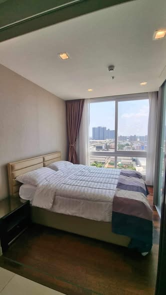 bedroom of The Metropolis Samrong
