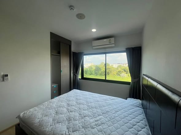 bedroom of The Metropolis Samrong