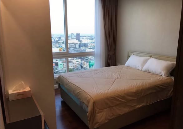 bedroom of The Metropolis Samrong