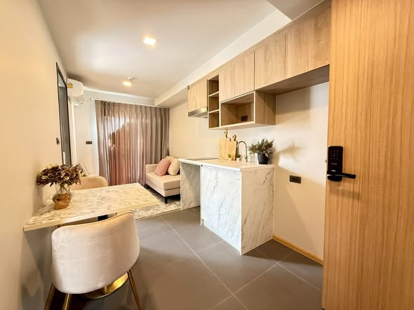 bedroom and bathroom of The Moment Ratchada 19