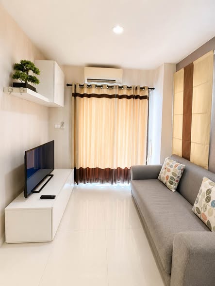 bedroom and living room of The Next Condo