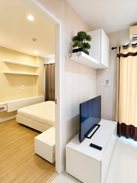 bedroom and living room of The Next Condo