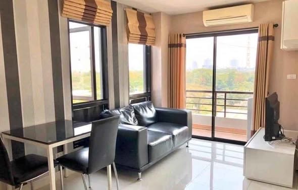 living room and bedroom of The Next Condo