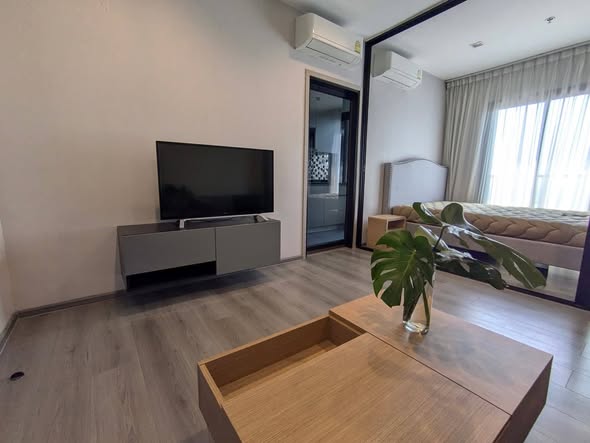 bedroom and living room of The Politan Rive