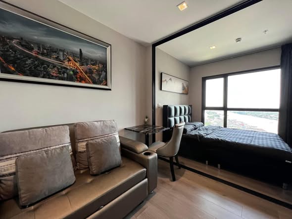 bedroom and living room of The Politan Rive