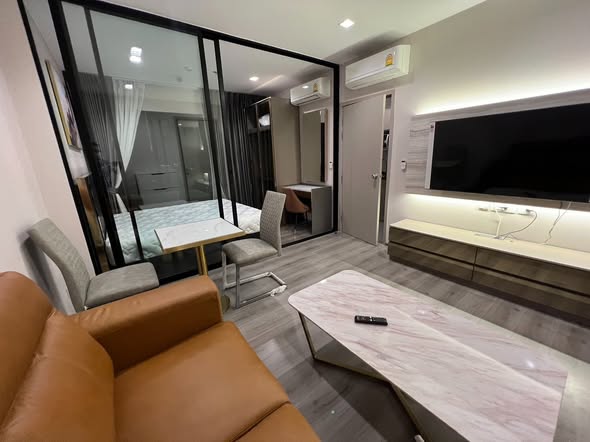 living room and bedroom of The Politan Rive