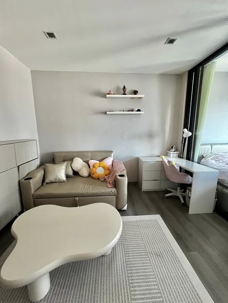 living room and bedroom of The Politan Rive