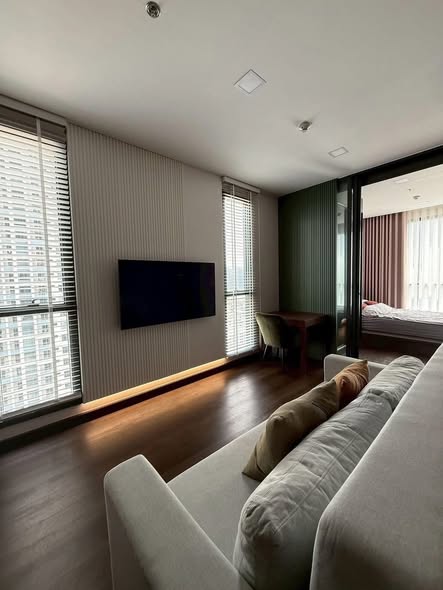bedroom and living room of The Privacy Jatujak