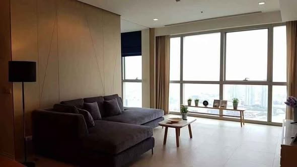 bedroom and living room of The River Condominium