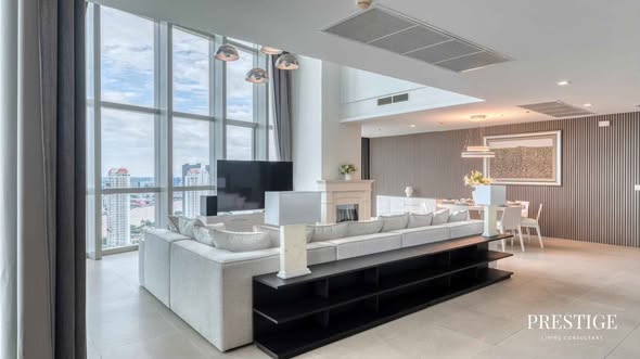 bedroom and living room of The River Condominium