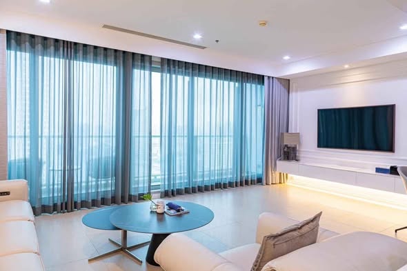 living room and bedroom of The River Condominium