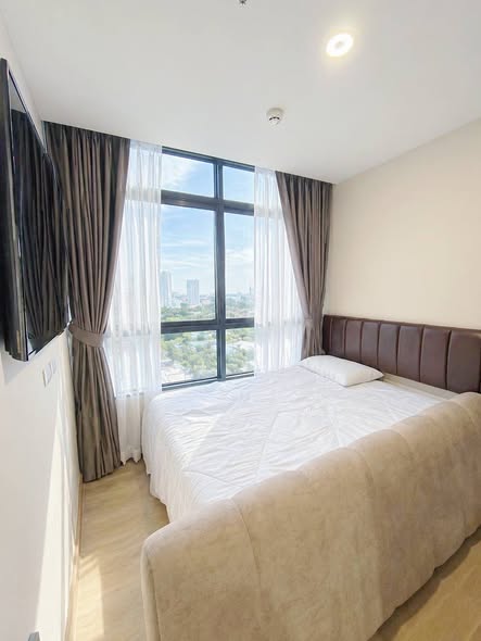 bedroom of The Strand Indeed Condo Sriracha