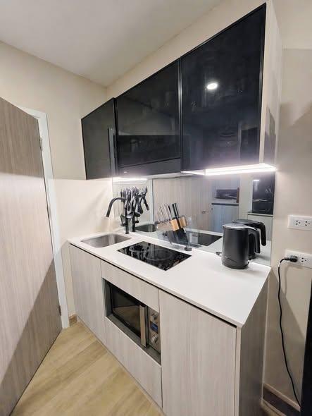 kitchen of The Strand Indeed Condo Sriracha