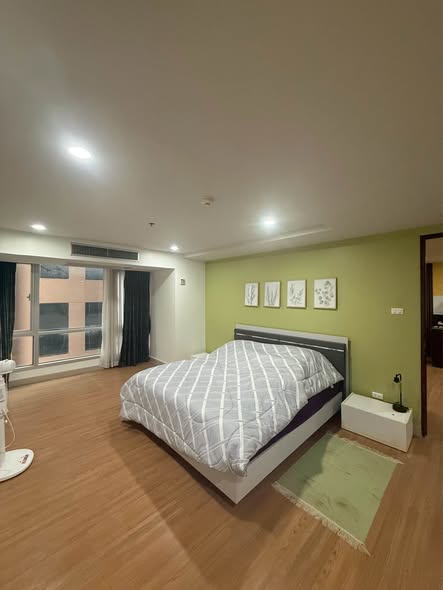 bedroom of The Trendy Condominium