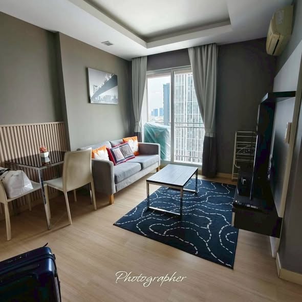 bedroom and living room of Thru Thong Lor