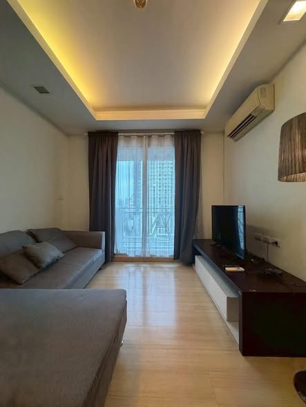 bedroom and living room of Thru Thong Lor